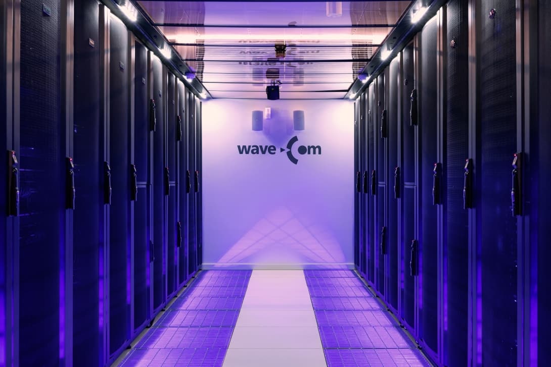 Aisle of server cabinets in the WaveCom data center