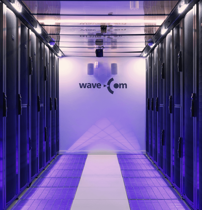 Server aisle with the WaveCom logo on the end wall